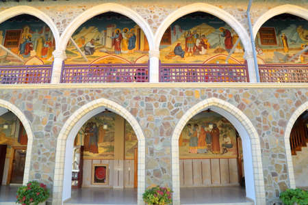 TROODOS MOUNTAINS, CYPRUS - NOVEMBER 18, 2015: The arcades inside Kykkos Monastery with colorful mosaicsのeditorial素材