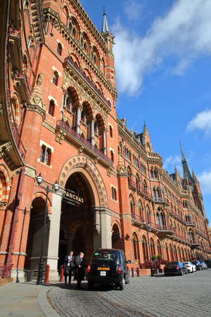 LONDON, UK - FEBRUARY 28, 2017: Exterior view of St Pancras Railway Station with a taxi in the foreground. This building  now houses the luxury St Pancras Renaissance Hotelのeditorial素材