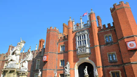 LONDON, UK - APRIL 9, 2017: The West front and main entrance of Hampton Court Palace in Southwest London with details of dragon statuesのeditorial素材