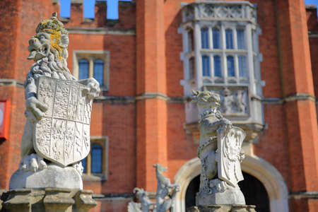LONDON, UK - APRIL 9, 2017: The West front and main entrance of Hampton Court Palace in Southwest London with details of dragon statuesのeditorial素材