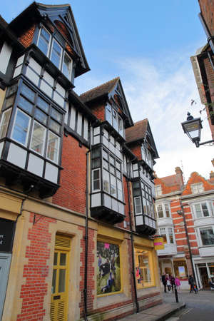 WINCHESTER, UK - FEBRUARY 4, 2017: Exterior facades in the commercial St Thomas Street and High Streetのeditorial素材