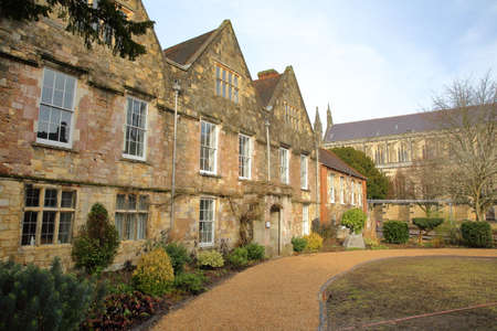 WINCHESTER, UK - FEBRUARY 4, 2017: Winchester Cathedral offices with the Cathedral in the background