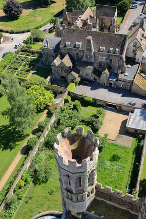 ELY, UK - MAY 26, 2017: Aerial view of the Bishop of Ely with a turret in the foreground - picture taken from the top of the West Tower of the Cathedralのeditorial素材
