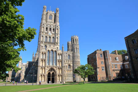 ELY, UK - MAY 26, 2017: View of The West front of the Cathedral from a public garden on a sunny dayのeditorial素材