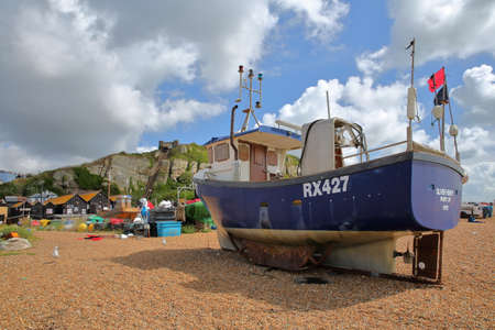 HASTINGS, UK - JULY 22, 2017: Beach launched fishing boats with East Hill in the backgroundのeditorial素材