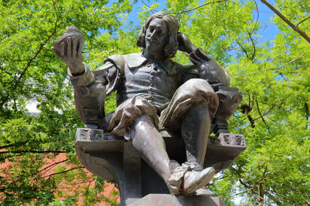 NORWICH, UK - JUNE 4, 2017: The statue of Sir Thomas Browne by sculptor Henry Alfred Pegram with a colorful backgroundのeditorial素材