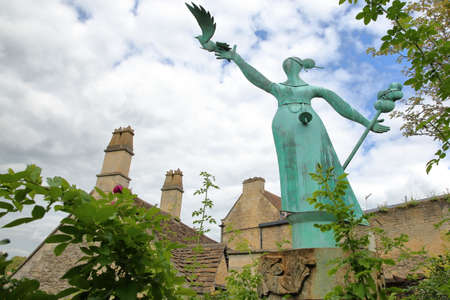 Bradford on Avon, UK - AUGUST 13, 2017: Millennium Statue with stone roofs in the backgroundのeditorial素材