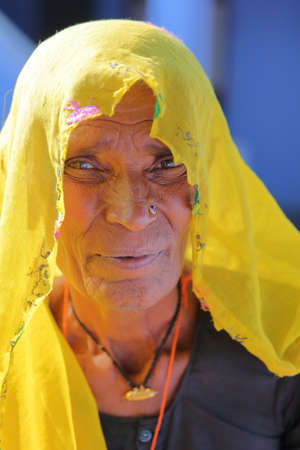 BUNDI, RAJASTHAN, INDIA - DECEMBER 09, 2017: Portrait of an old woman with colorful dress in a...
