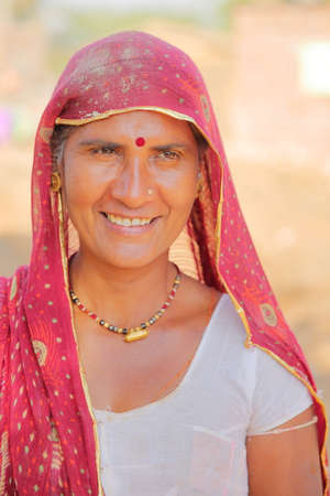 BUNDI, RAJASTHAN, INDIA - DECEMBER 09, 2017: Portrait of a beautiful woman with colorful dress in a village close to Bundiのeditorial素材