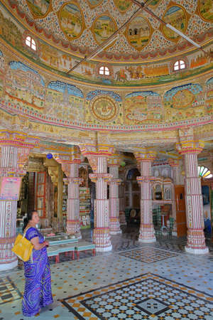 BIKANER, RAJASTHAN, INDIA - DECEMBER 23, 2017: Interior of the Jain Bhandasar Temple located in the Old city, with colorful carvings and paintings and patterned pavementのeditorial素材