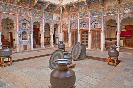 DUNDLOD, RAJASTHAN, INDIA - DECEMBER 27, 2017: Seth Arjundas Goenka Haveli Museum with colorful frescoes and paintingsのeditorial素材