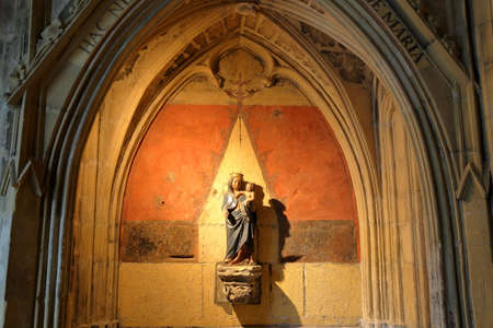MAASTRICHT, NETHERLANDS - AUGUST 03, 2019: A statue of Virgin Mary and a child, located in the cloister of the basilica of Saint Servatius, 11th century Cathedralのeditorial素材