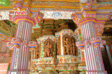 BIKANER, RAJASTHAN, INDIA - DECEMBER 23, 2017: Interior of the Jain Bhandasar Temple located in the old city, with colorful carvings and paintingsのeditorial素材