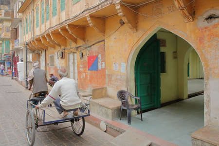 JAIPUR, RAJASTHAN, INDIA - DECEMBER 06, 2017: Street scene inside Jaipur old city with traditional...