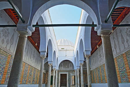 KAIROUAN, TUNISIA - DECEMBER 10, 2019: The Abou Zamaa Zaouia (Barber's mosque or Sidi Sahbi mosque), with colorful tiles, columns and arcadesのeditorial素材