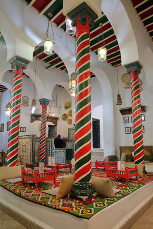 TUNIS, TUNISIA - JANUARY 01, 2020: The impressive colorful interior of El Mrabet Cafe, located inside the medina, with twisted columns and a high vaulted ceilingのeditorial素材