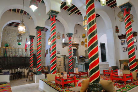 TUNIS, TUNISIA - JANUARY 01, 2020: The impressive colorful interior of El Mrabet Cafe, located inside the medina, with twisted columns and a high vaulted ceilingのeditorial素材