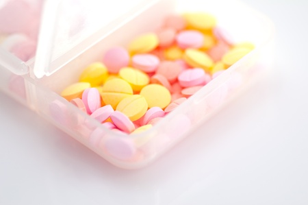 medical pills in box on white background