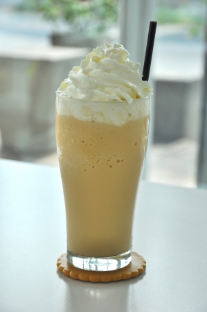 Coffee drinks with cream in glassの写真素材