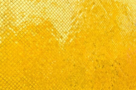 golden wall brick of thai templeの写真素材