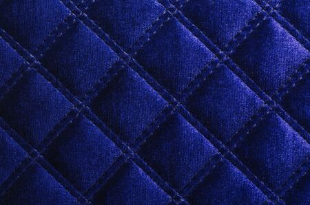 Dark blue velvet cushion as beautiful backdrop.の写真素材