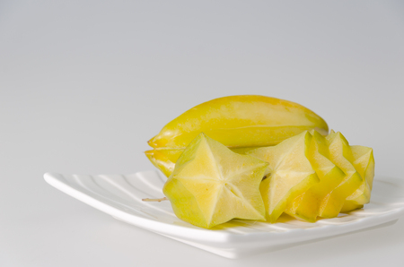 fresh star apple fruit on plateの写真素材