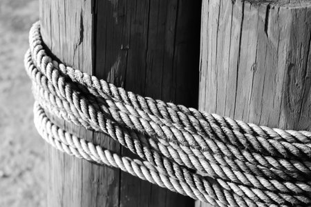 Ropes tied tightly around strong wood polesの写真素材