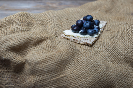 fresh blueberries on crispbread with cream cheeseの写真素材
