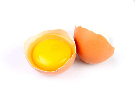 broken egg with yolk isolated on white background
