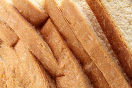 delicious bread in pieces on white backgroundの写真素材