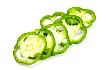 many pieces of green pimento isolated on white の写真素材