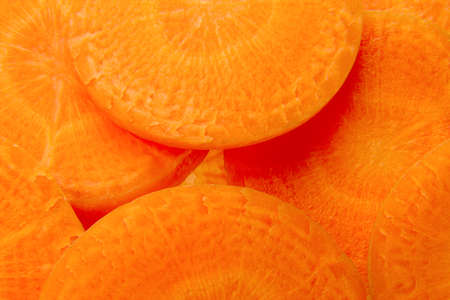 background full of many fresh carrot slices