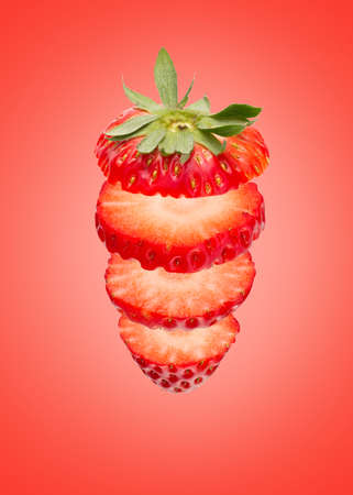 Cutted Fresh Strawberry on Red backgroundの写真素材