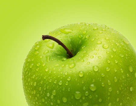 Perfect Fresh Green Apple Isolated on Green Background in Full Depth of Fieldの写真素材