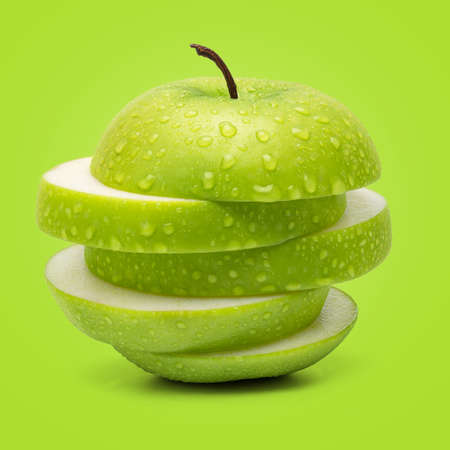 Perfect Fresh Green Apple Isolated on Green Background in Full Depth of Field.の写真素材