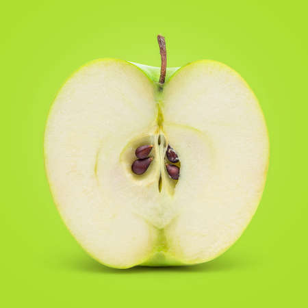 Perfect Fresh Green Apple Isolated on Green Background in Full Depth of Field.の写真素材
