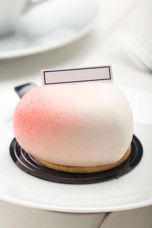 A Cute Pink Heard-shaped mousse on the Table.