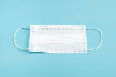 Medical mask on blue background.の写真素材