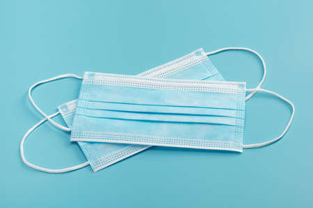 Medical masks on blue background.の写真素材