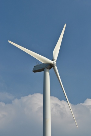 Wind turbine propeller blades against blue skyの写真素材