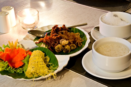 Khao Chae, an ancient Thai food, rice in cold water with ice served with various Thai side dishesの写真素材