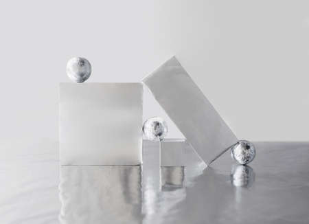 Scene with geometric shapes covered by metallic foil. Creative composition, art concept.の写真素材