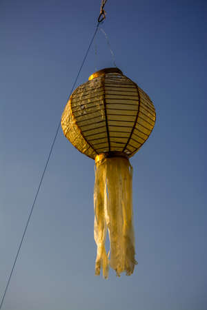 chainess lamp in thai style with blue skyの写真素材