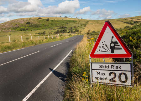 warning sign concerning dangerous road surfaceの写真素材