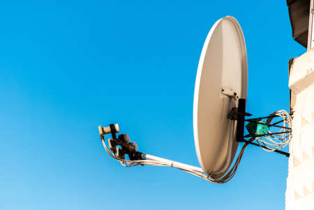 satellite dish on blue sky の写真素材