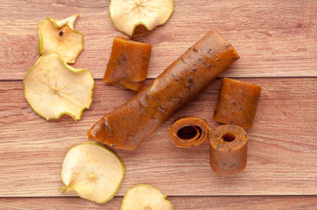 Homemade fruit leather of grape on a wooden background. Pastila. Fruit rolls. Fresh fruitsの写真素材