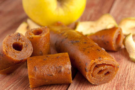Homemade fruit leather of grape on a wooden background. Pastila. Fruit rolls. Fresh fruitsの写真素材