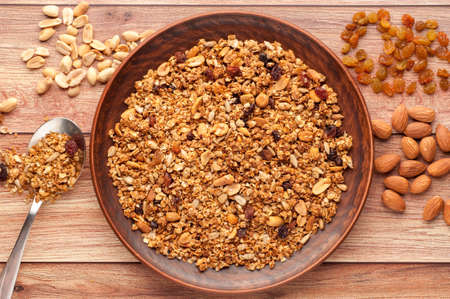 Bowl with granola on a wooden backgroundの写真素材