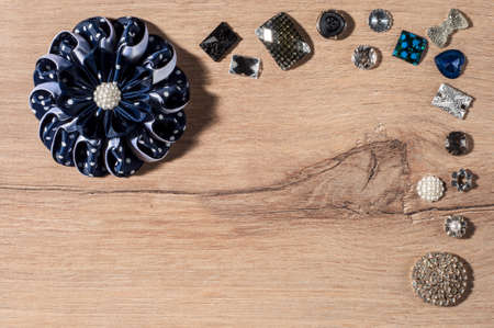 DIY flower from ribbon on wooden background.Copy spaceの写真素材