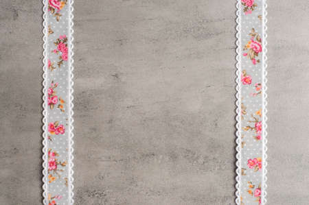 Ribbon on a grey background.Copy space.Flower ribbon.Handmadeの写真素材